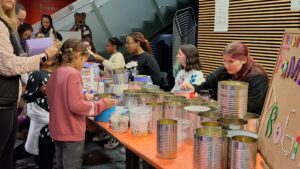 Families interact with a display at Eventapalooza