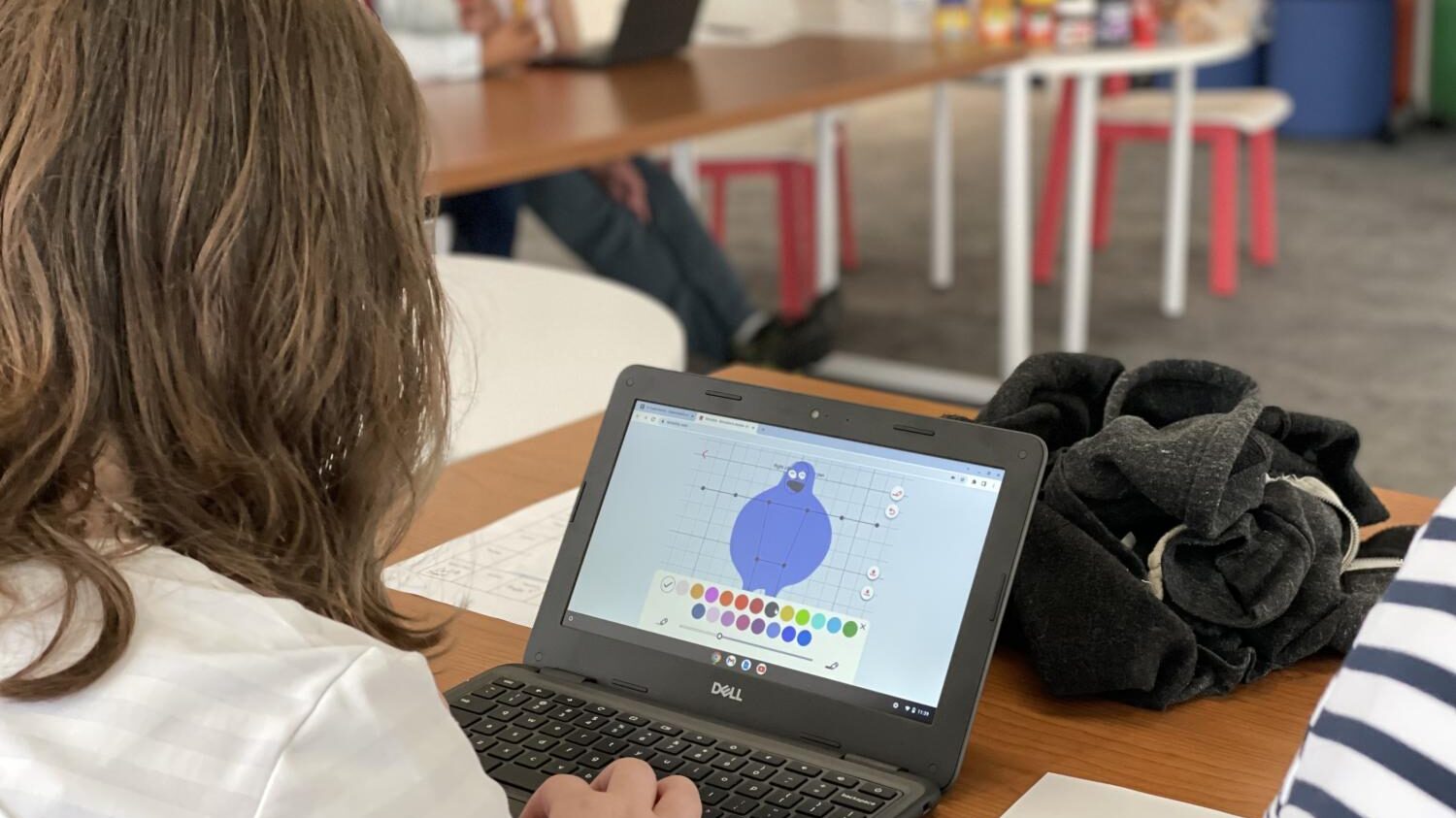 A student looking at a laptop screen