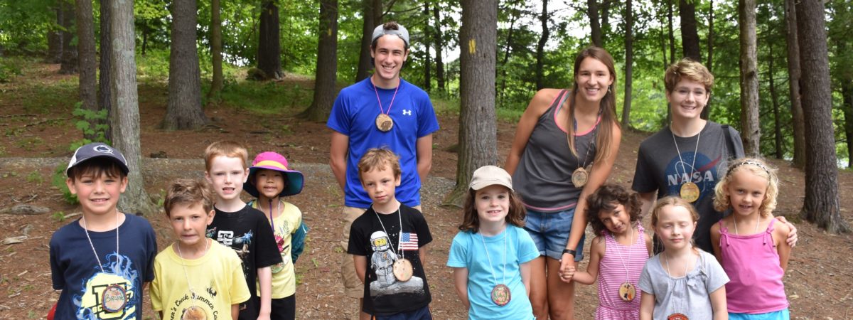 Children with award medals around their necks