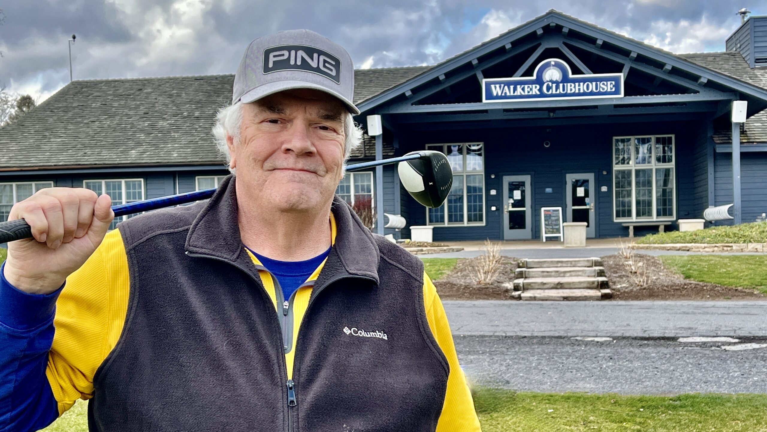 Greg Petersen standing outside the clubhouse at the Penn State Golf Course