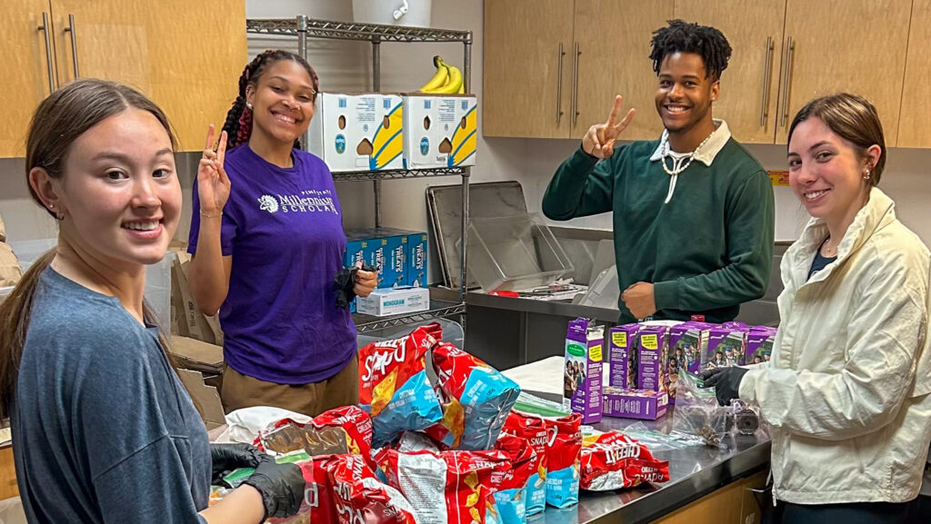 students making lunch to pass out during their L.A. Street Medicine trip