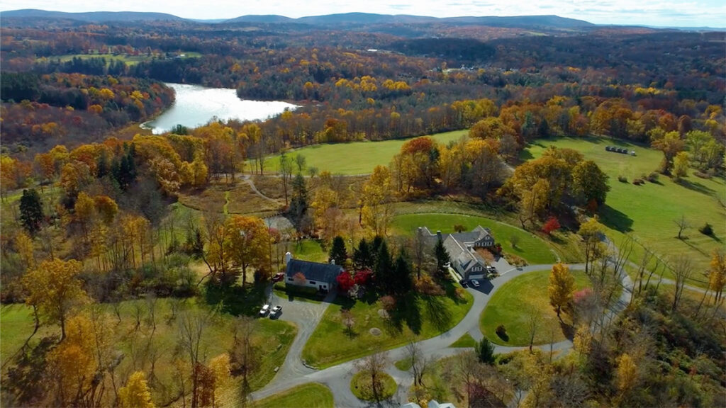 An overhead view of the Fullers Overlook property with mountains and a lake in the background